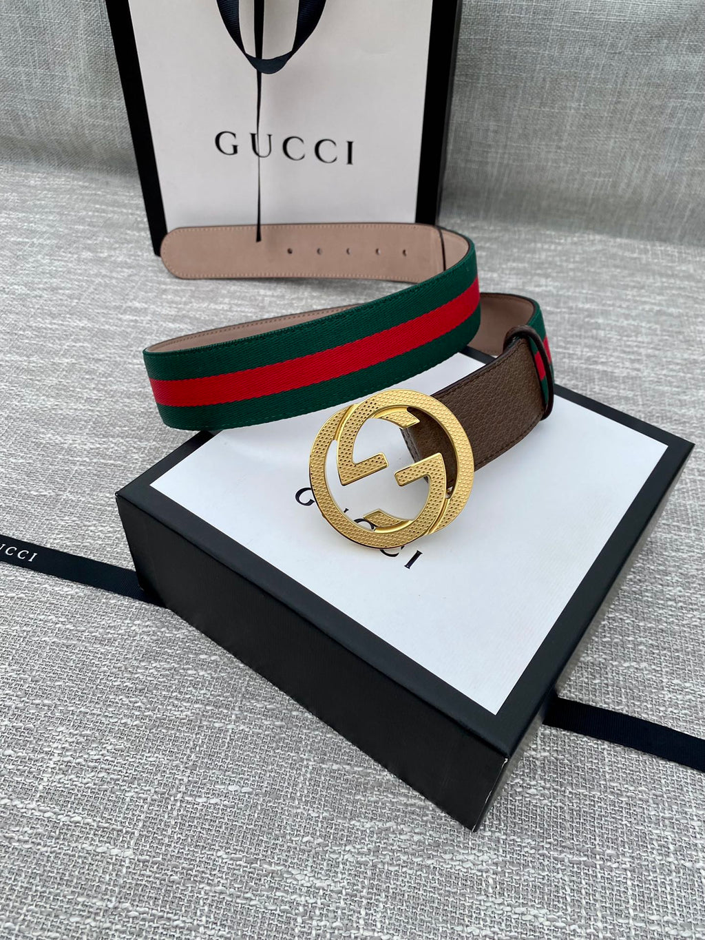 Brown leather Gucci belt with gold-tone GG buckle and green/red web stripe, boxed