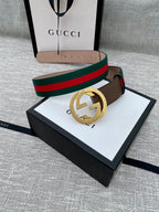 Brown leather Gucci belt with gold-tone GG buckle and green/red web stripe, boxed