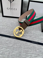 Gucci belt with brown leather strap and gold-tone double G buckle, set with green-red web stripe.