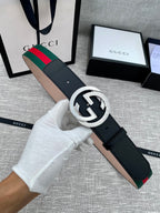 Black leather belt with silver-tone GG buckle and green-red web stripe