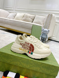 White low-top sneaker with laces, side graphic reading “THE NORTH FACE GUCCI”.