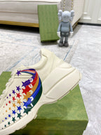 Close-up of white sneaker with star-and-flag graphic on side, lace-up