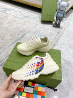 White unisex sneakers with star-and-flag side detail, shown on box
