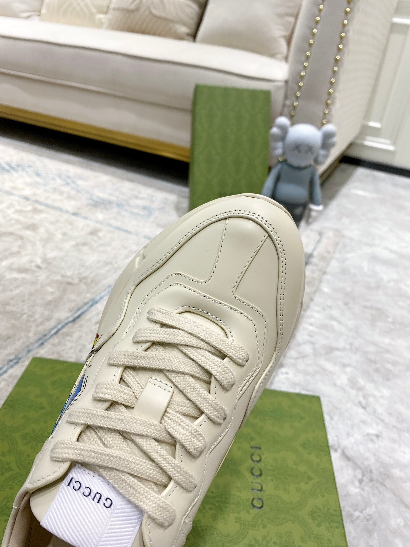 White Gucci unisex sneaker, side close-up with laces