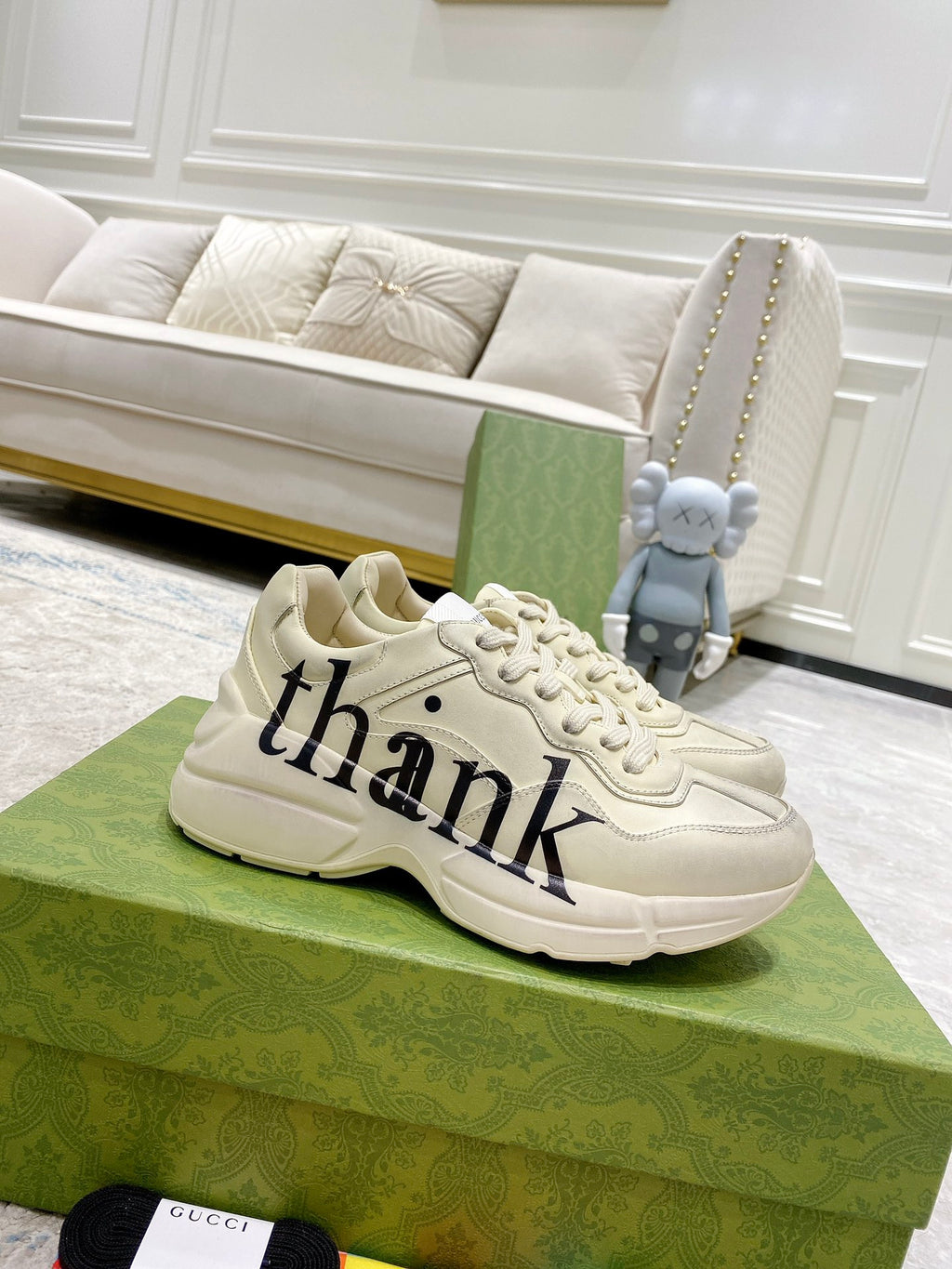 Cream Gucci unisex sneakers with 'thank' script on side, lace-up design