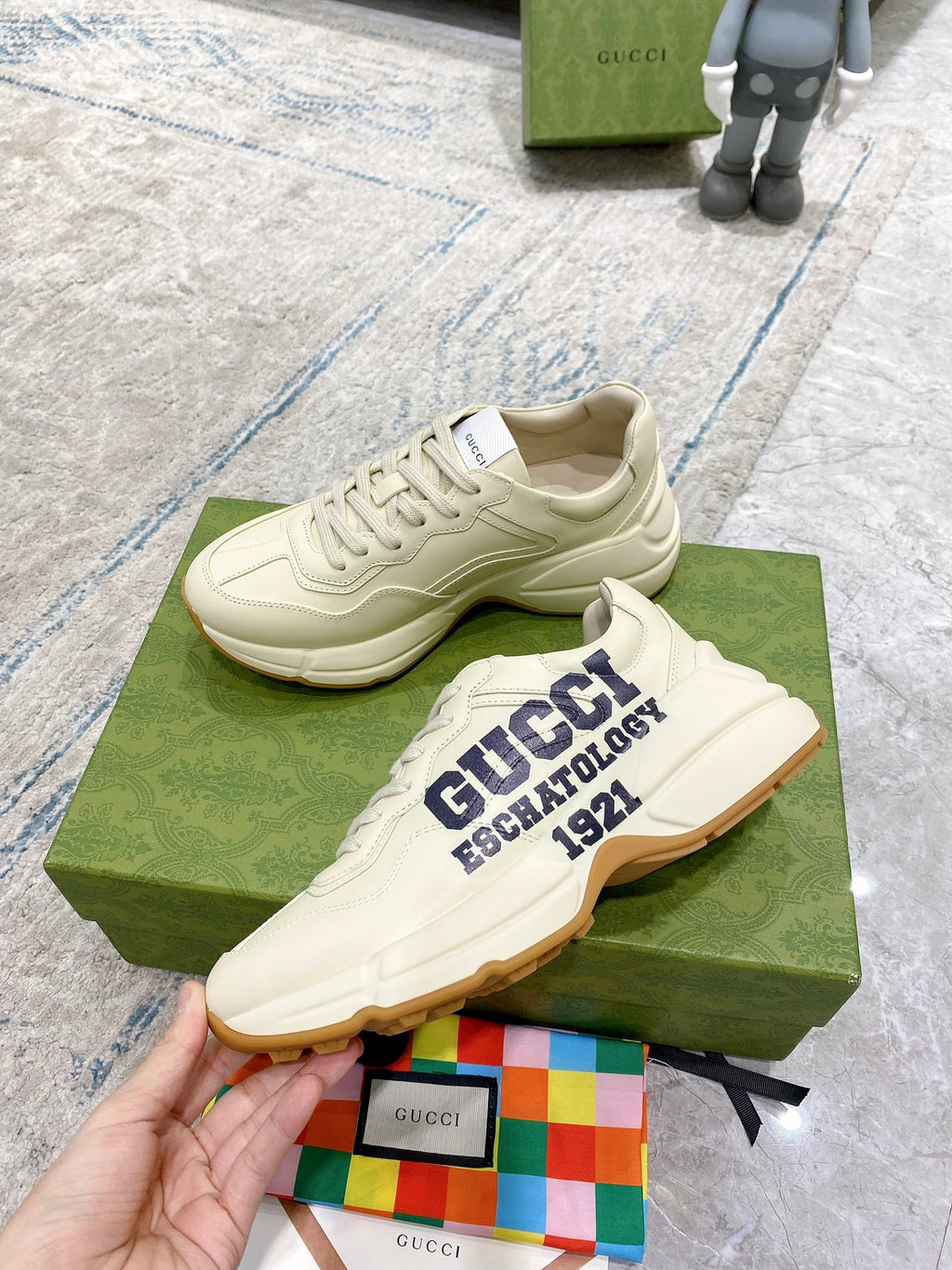Cream lace-up sneakers with "GUCCI ESCHATOLOGY 1921" logo