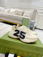 Cream lace-up sneakers with navy 25 graphic on side