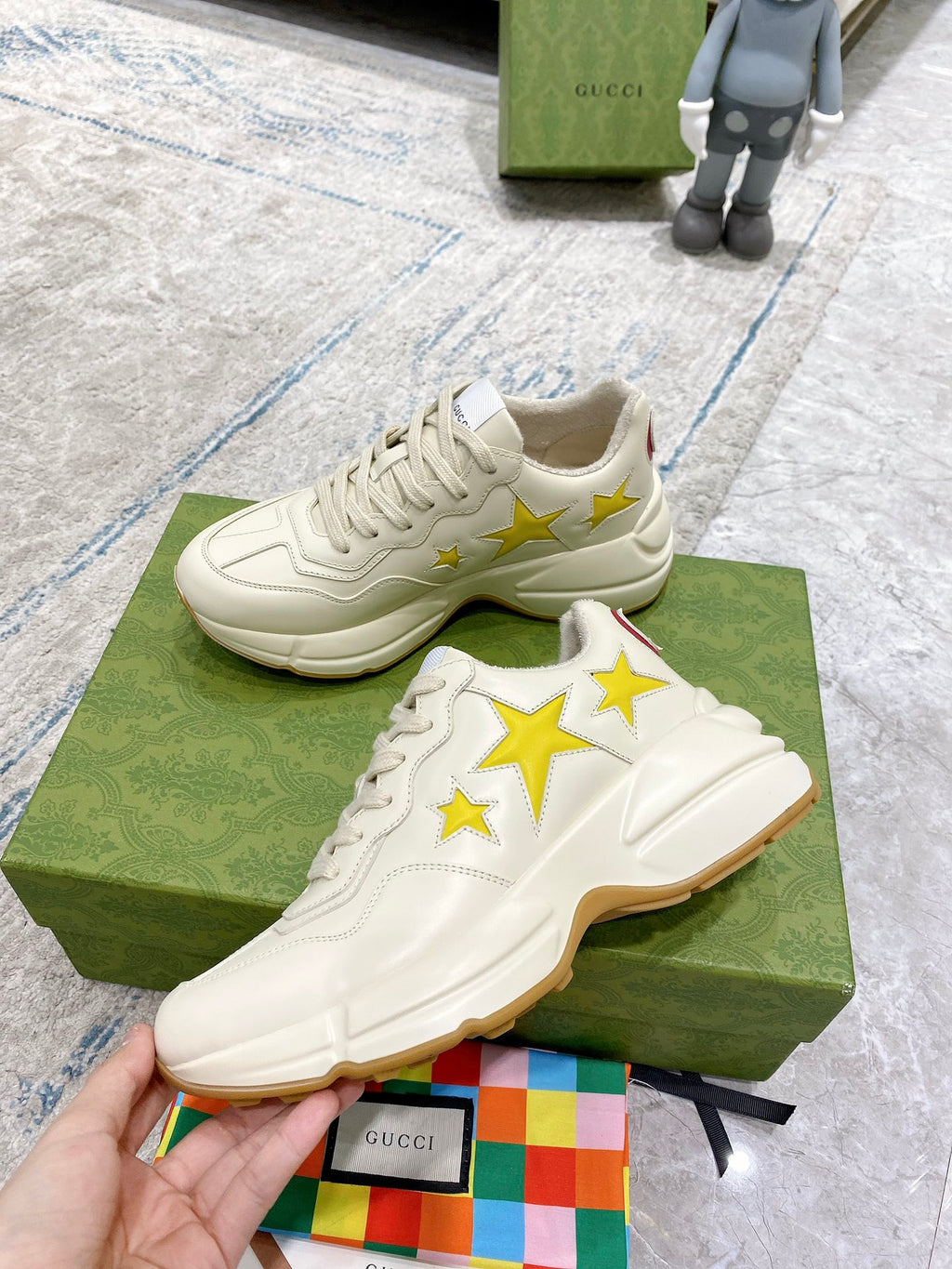 Gucci unisex sneakers, white leather look with yellow stars and textured sole