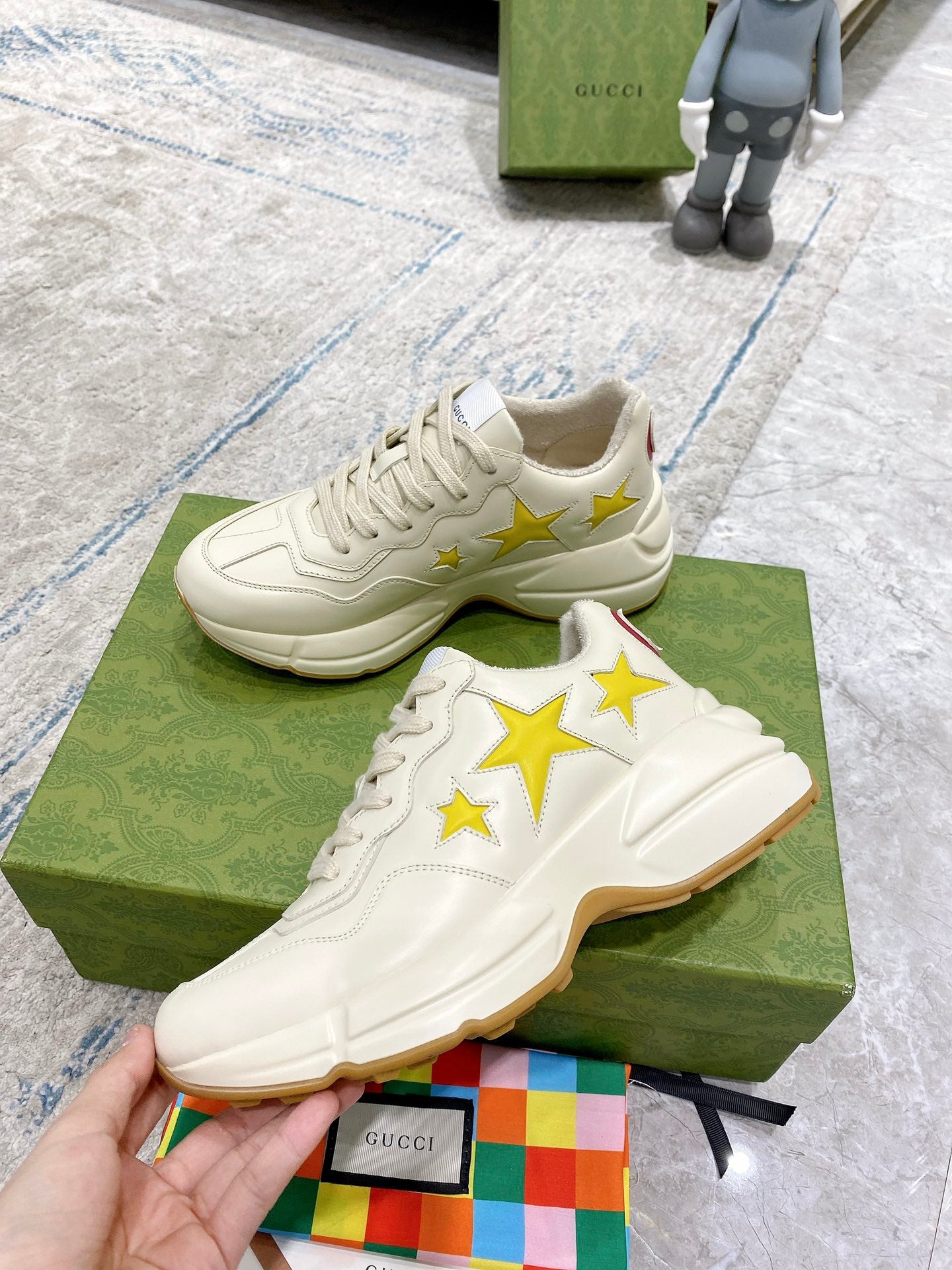 Gucci unisex sneakers, white leather look with yellow stars and textured sole