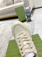 Gucci unisex white sneaker toe and laces, red star accent on side