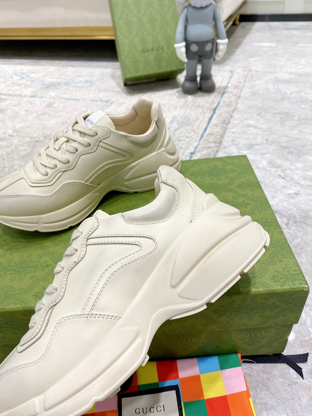 Gucci white sneaker detail with stitched trim and textured sole edge