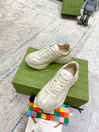 Gucci white lace-up sneakers with stitched overlays and rubber sole