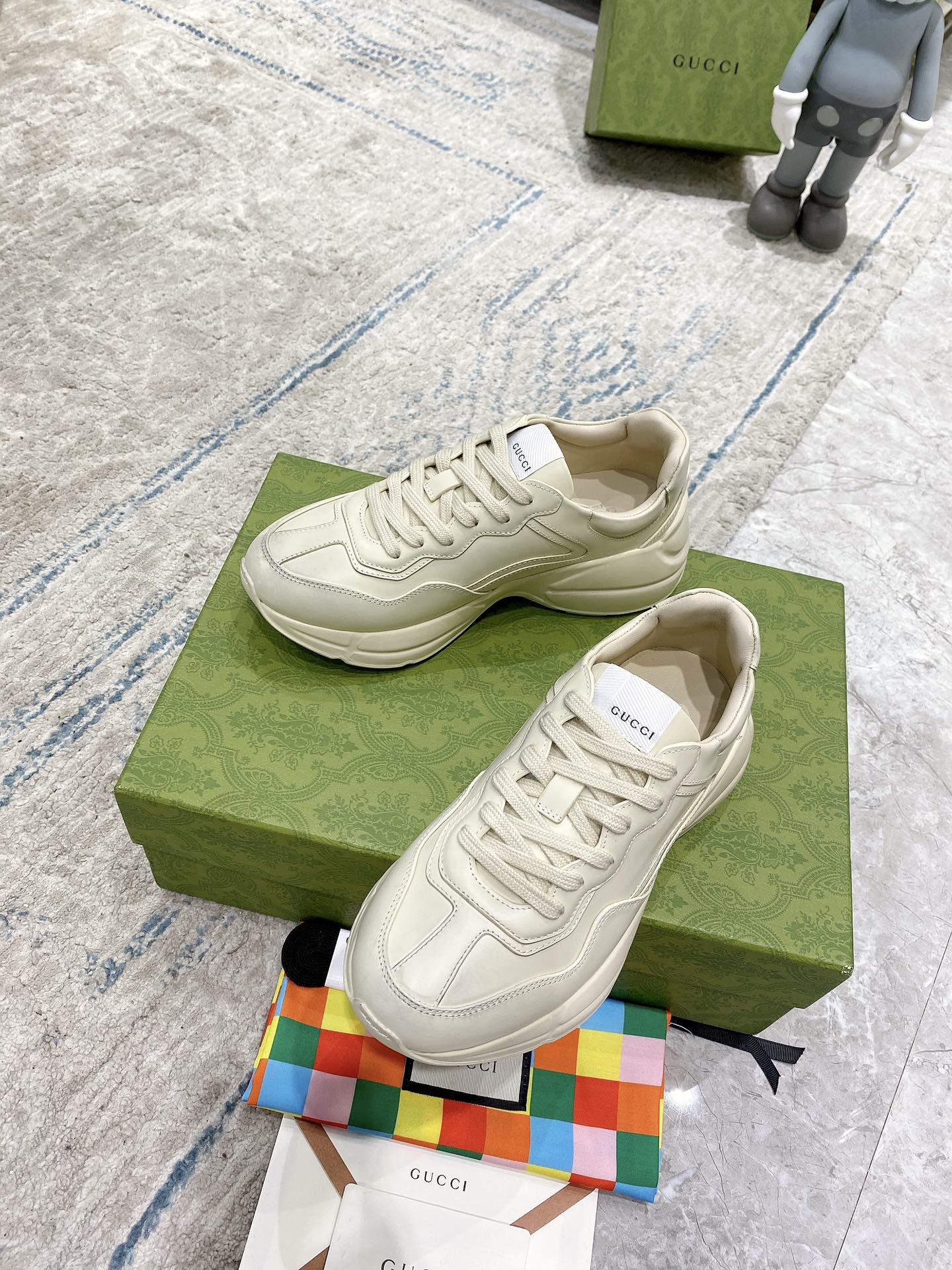 Gucci white lace-up sneakers with stitched overlays and rubber sole
