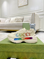 Gucci unisex luxury sneakers, white with multicolor side logo stripe on chunky sole