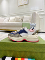 Gucci unisex luxury sneaker with blue, beige logo upper and red-trimmed sole