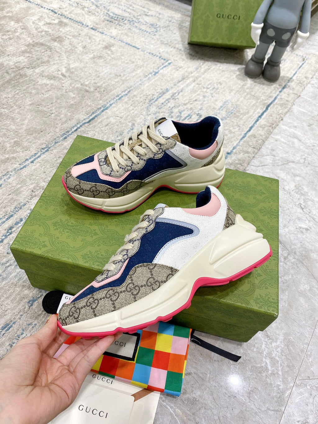 Gucci unisex luxury sneaker with beige laces, blue and pink upper, cream sole