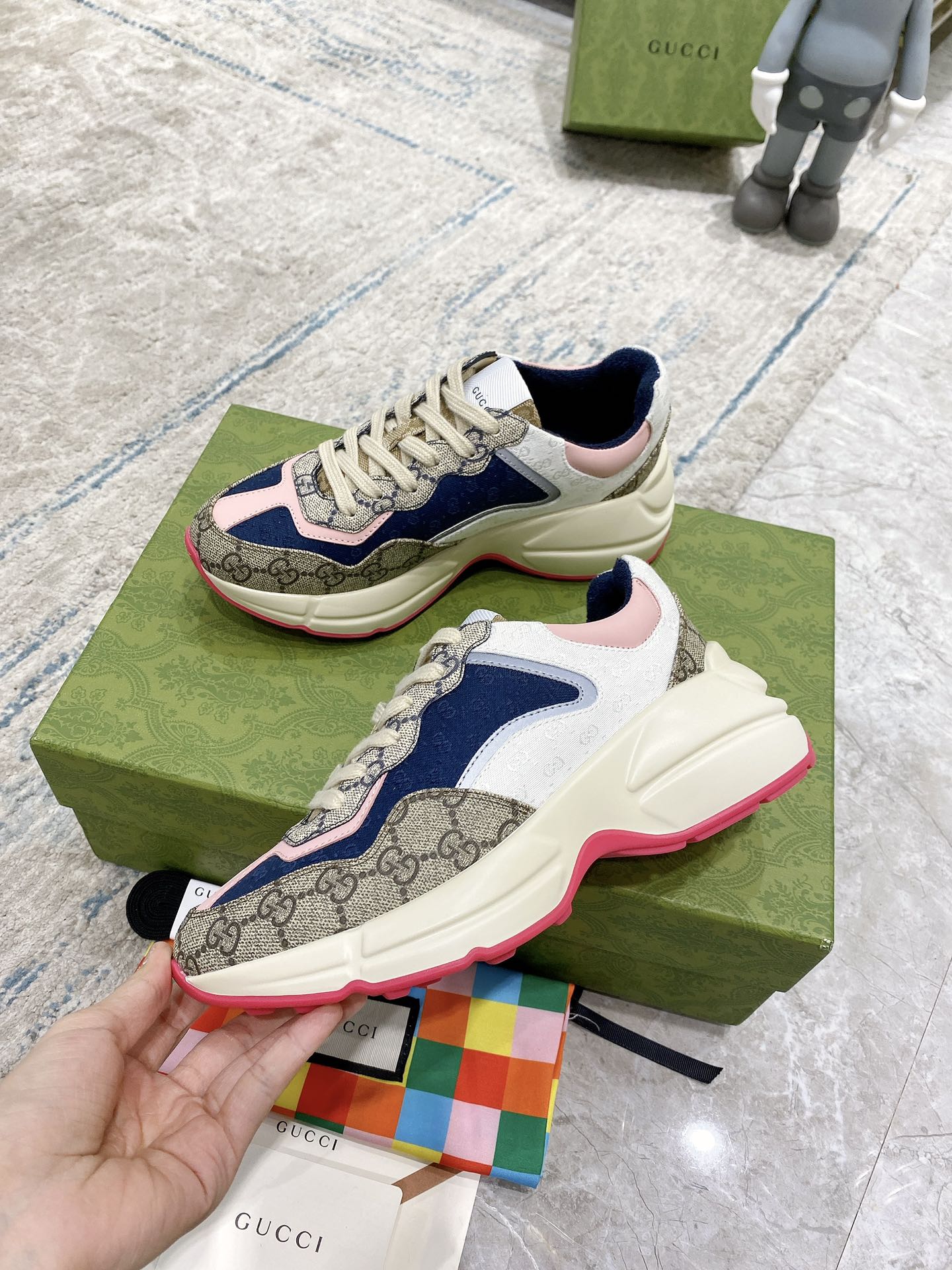 Gucci unisex luxury sneaker with beige laces, blue and pink upper, cream sole