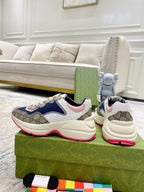 Gucci unisex luxury sneakers, front and heel views with blue upper and pink lining