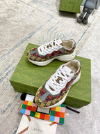 Canvas sneakers with multicolor GG print and white laces on green shoebox
