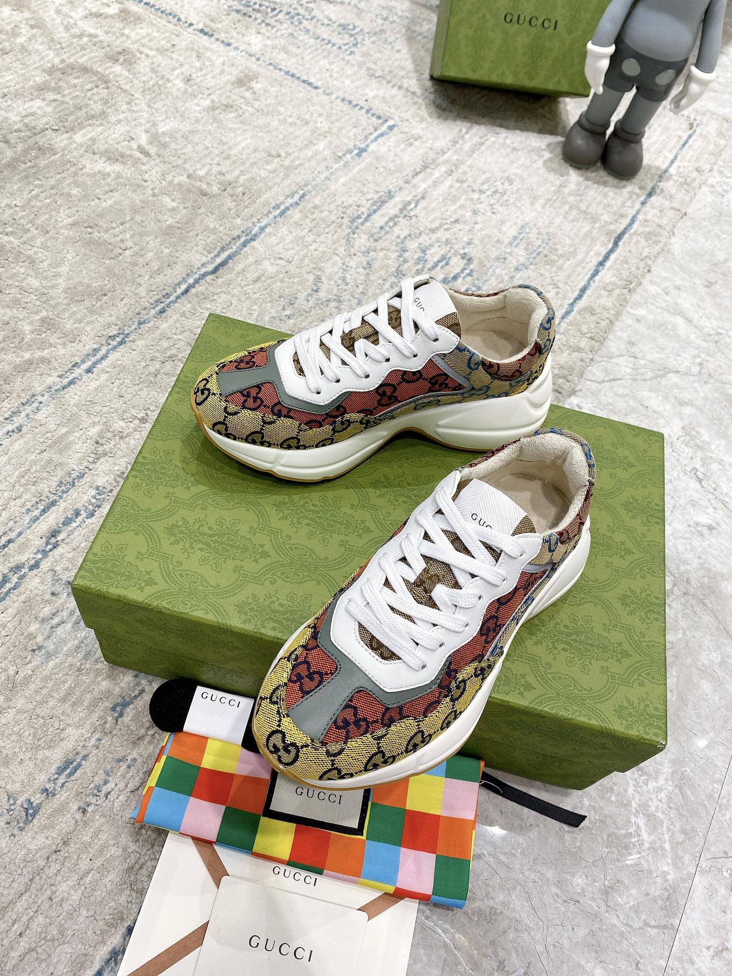 Canvas sneakers with multicolor GG print and white laces on green shoebox