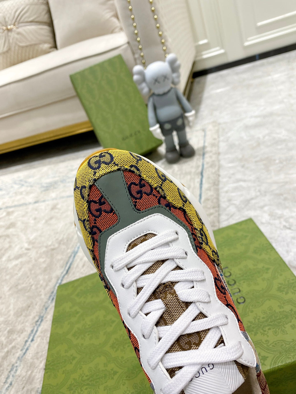 Single canvas sneaker with multicolor GG pattern, white laces, and white sole