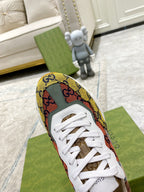 Single canvas sneaker with multicolor GG pattern, white laces, and white sole