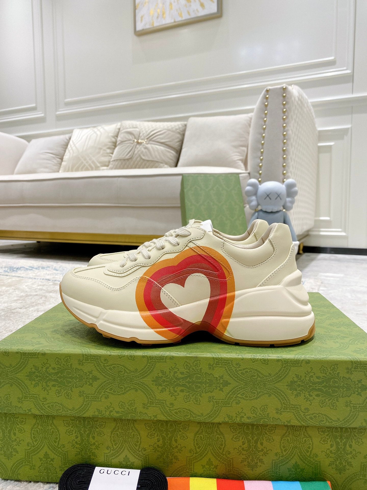 White Gucci unisex sneaker with heart graphic stripe and lace-up front