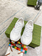 White Gucci unisex sneakers, lace-up style with WORLDWIDE text