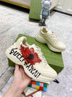 Gucci unisex sneakers, white leather with red flower print and black lettering