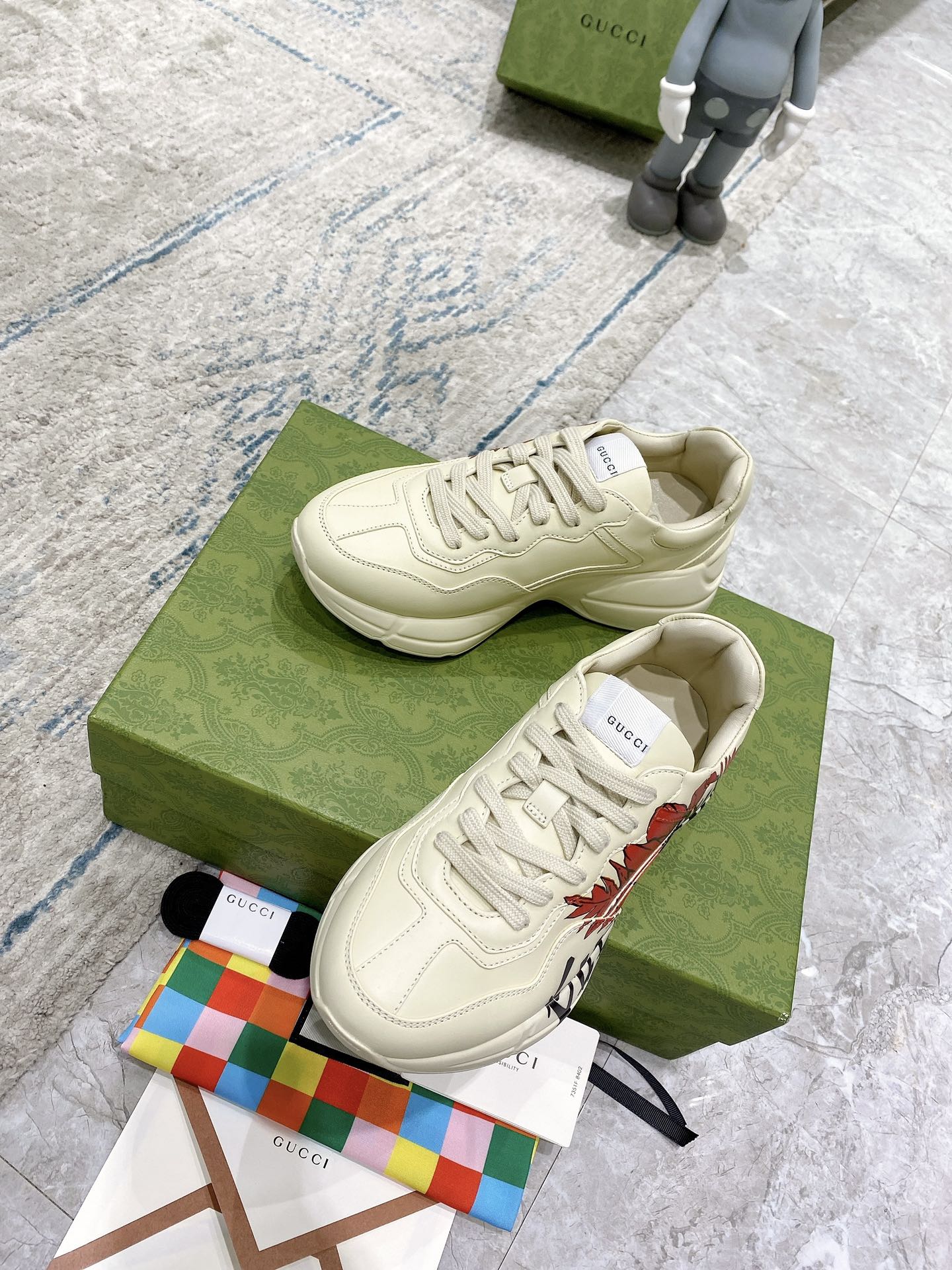 Gucci unisex sneakers, white low-top pair with red floral side graphic