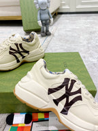 Gucci unisex low-top sneakers, light cream with black NY logo and lace-up closure