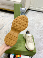 Gucci unisex sneaker outsole with light gum tread, cream shoes on box