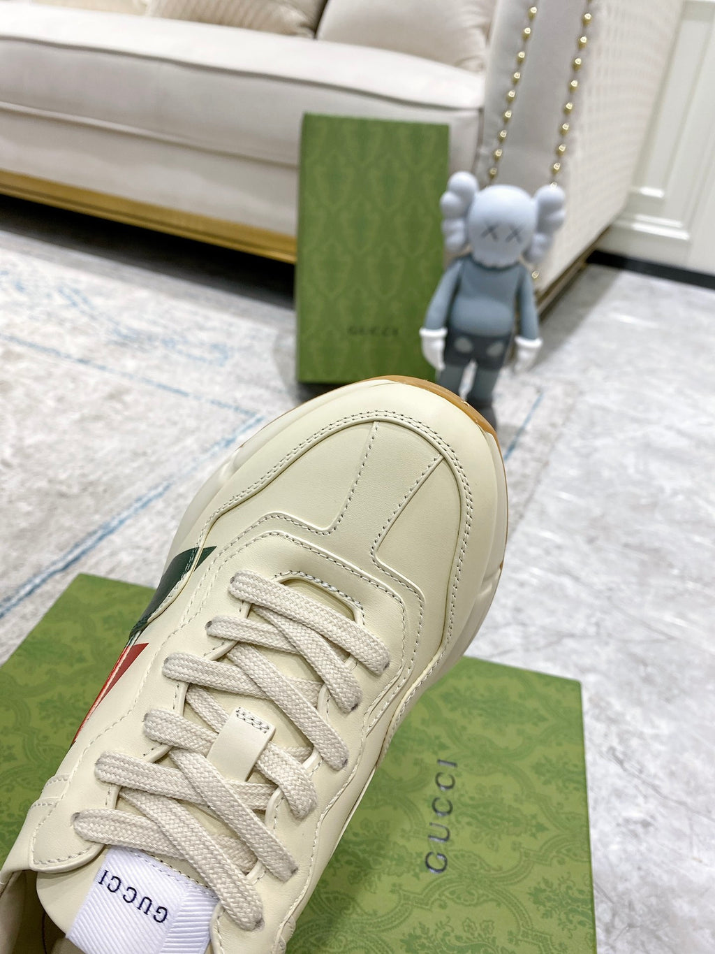 Unisex white leather sneaker upper with lace-up closure and stitch detailing.