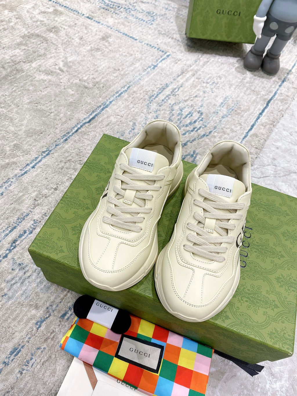 Gucci unisex luxury sneakers, white leather with lace-up and multicolor stripe detail