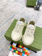 Gucci unisex luxury sneakers, white leather with lace-up and multicolor stripe detail