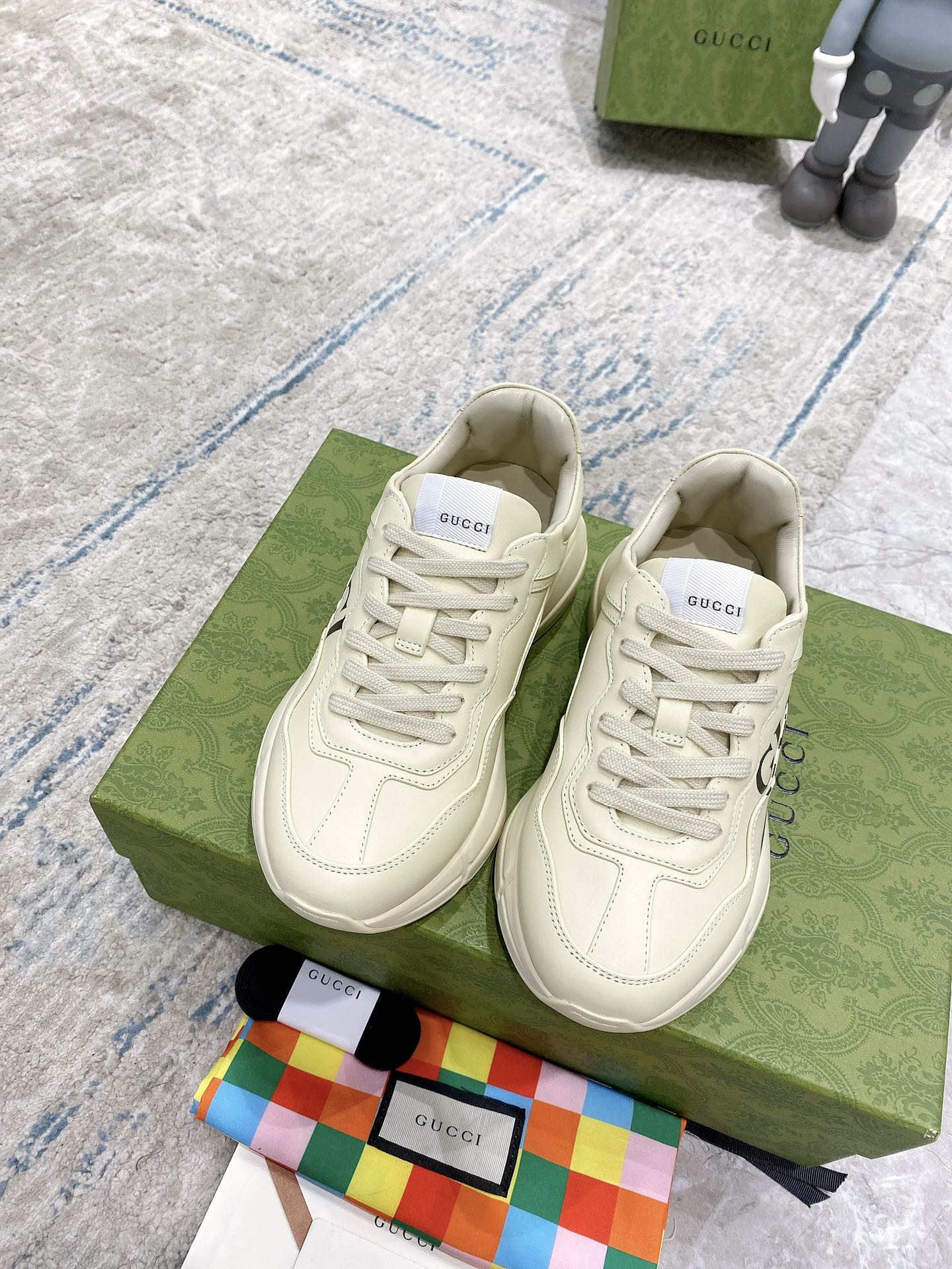 Gucci unisex luxury sneakers, white leather with lace-up and multicolor stripe detail