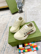 Gucci unisex luxury sneakers, white lace-up with multicolor stripe accents