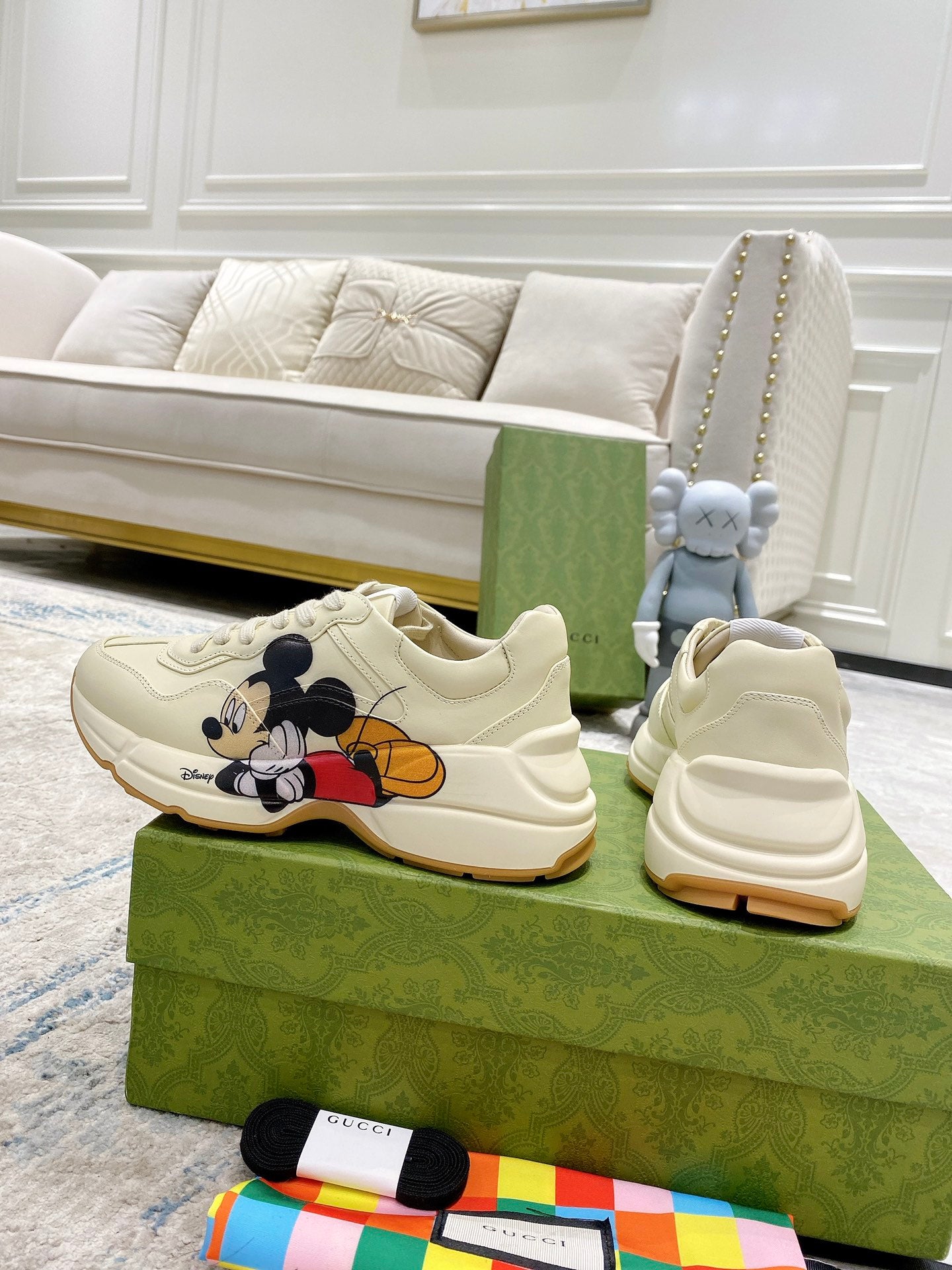 Gucci unisex sneakers pair, cream leather with Mickey Mouse graphic on the side