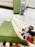 Gucci unisex sneakers, cream leather with Mickey Mouse side design and gum trim