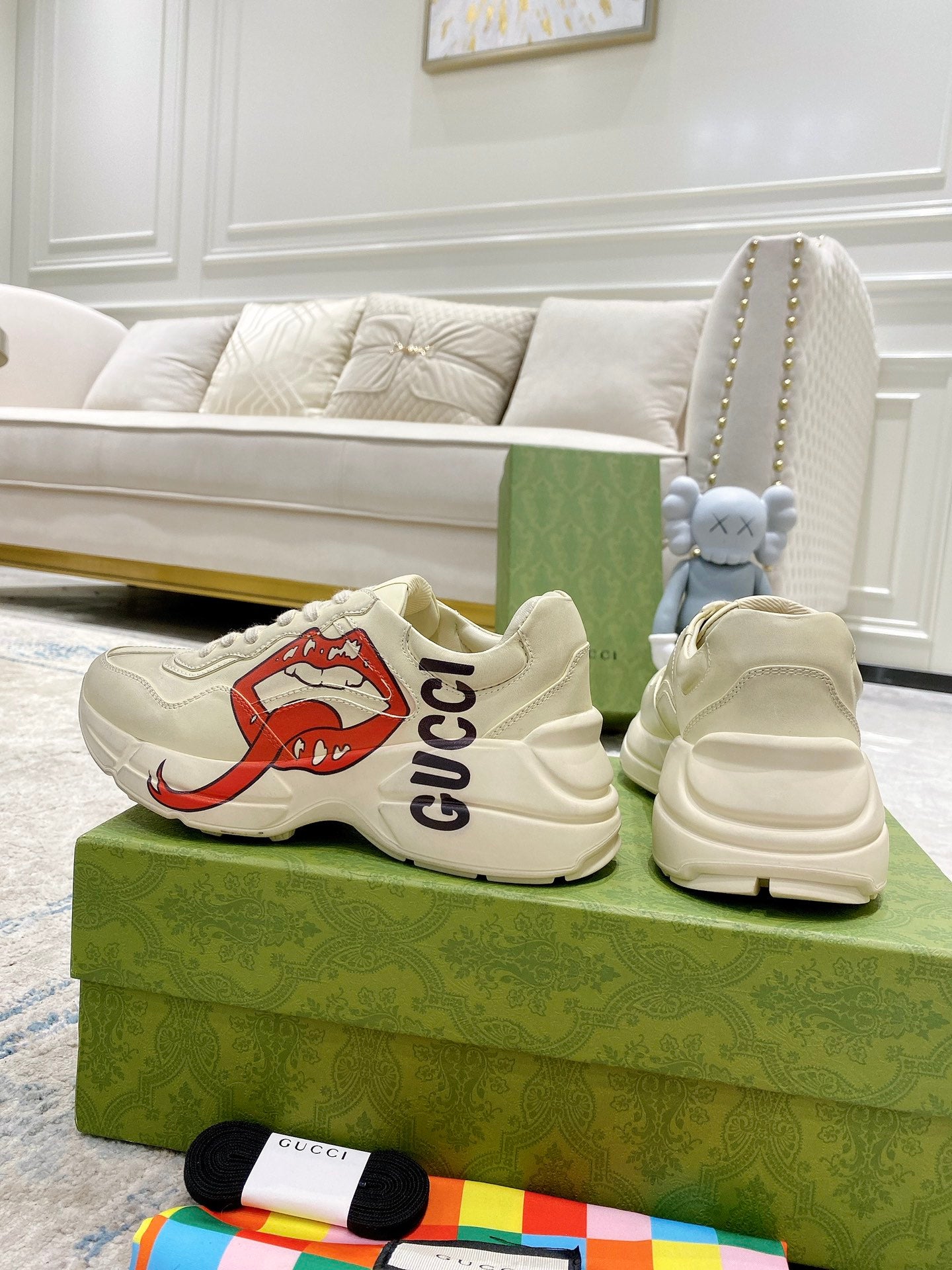 Pair of light-cream Gucci unisex sneakers showing toe and heel profiles
