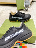Gucci unisex sneakers, black upper close-up with GucciBand logo and gum trim