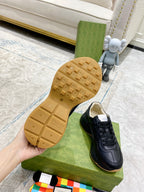 Gucci unisex sneaker outsole view, textured rubber sole on green box