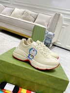 Gucci unisex sneakers, white leather with lace-up front and red outsole trim