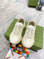 Gucci unisex sneakers, white leather lace-up shoes on green box