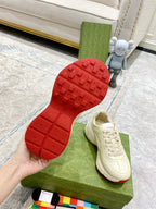 Gucci unisex sneakers, white leather soles shown with red tread outsole