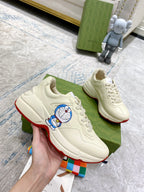 Gucci unisex sneakers, white leather lace-up with Doraemon graphic and red sole