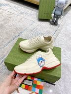 Gucci unisex sneakers, white leather with Doraemon patch and red-trimmed sole