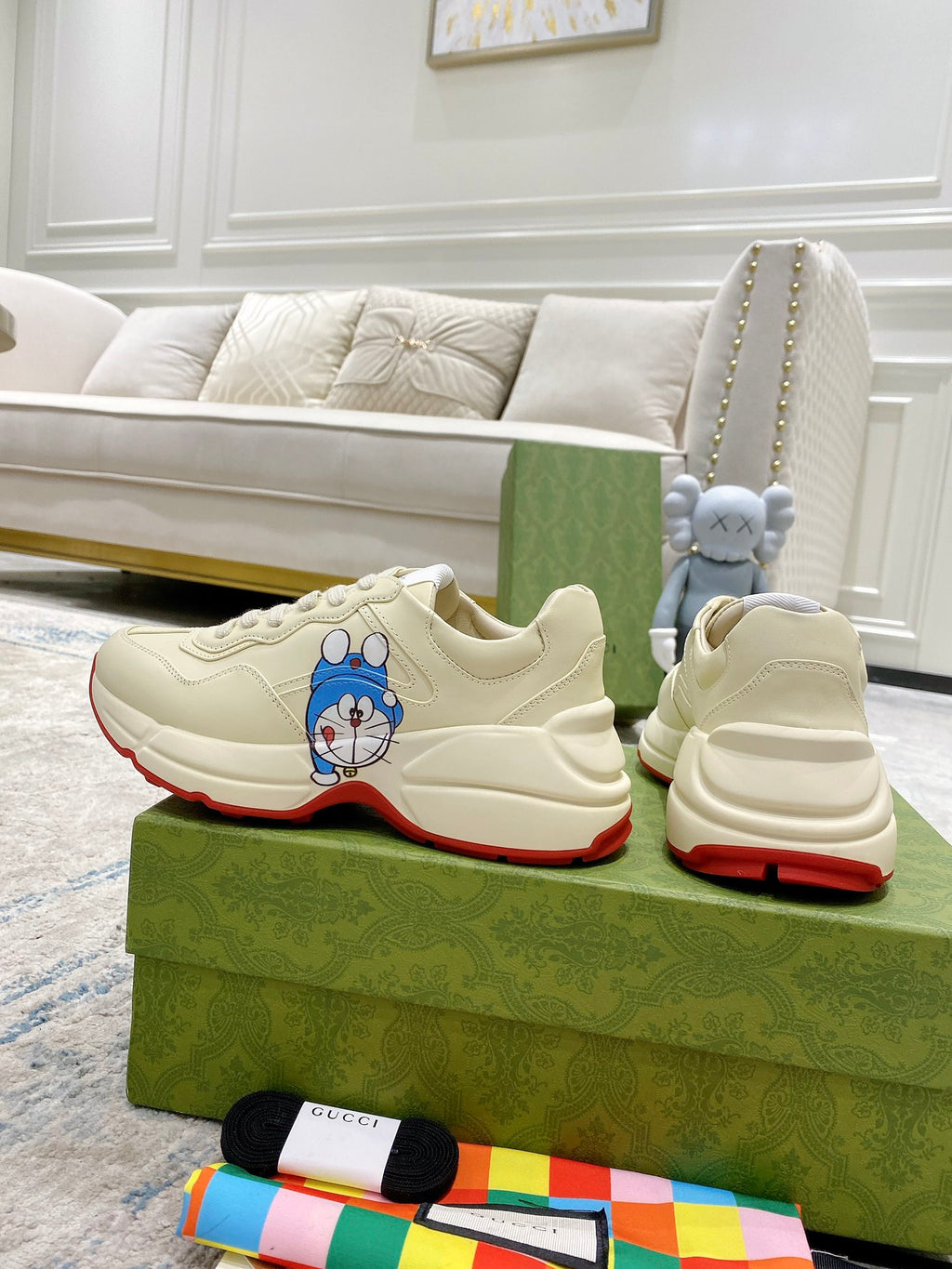 Gucci unisex sneakers pair, white leather with Doraemon patch and red outsole