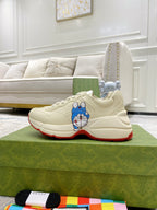 Gucci unisex sneakers, white leather with Doraemon patch on side and red sole edge