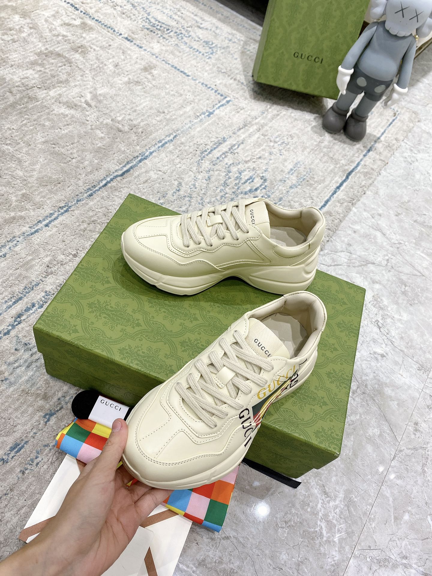 Gucci unisex white sneakers, lace-up design with side GG stripe and rubber outsole.